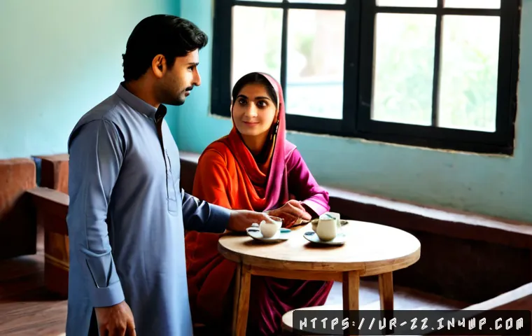 Home 17 생성적 대화법에서의 경청 기술 - Photorealistic scene of two Pakistani colleagues having a thoughtful conversation in a bright modern...